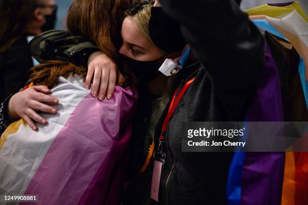 Adolescents opposed to SB 150 hug each other after a press conference held by supporters of SB 150 on March 29, 2023 at the Kentucky State Capitol in...