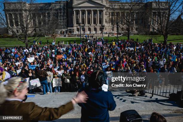 Demonstrators face a speaker during a rally to protest the passing of SB 150 on March 29, 2023 at the Kentucky State Capitol in Frankfort, Kentucky....