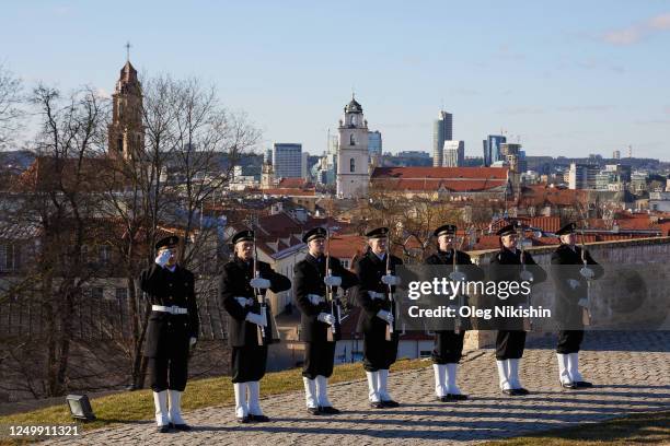 Lithuanian soldiers stand to attention the opening of the exhibition 'Powerful Because United' dedicated to the 19th anniversary of Lithuania's...