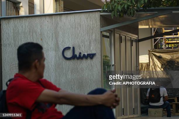Young Salvadoran observes the sign on the structure of an ATM of the Chivo state bitcoin wallet in different places on March 29, 2023 in San...