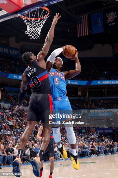 Luguentz Dort of the Oklahoma City Thunder goes to the basket against the Detroit Pistons on March 29, 2023 at Paycom Arena in Oklahoma City,...