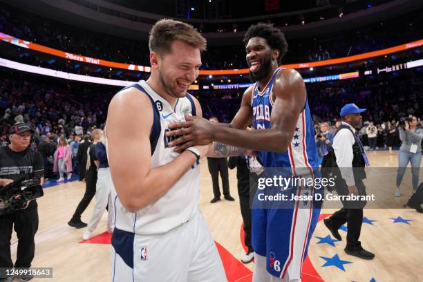 Luka Doncic of the Dallas Mavericks talks with Joel Embiid of the Philadelphia 76ers after the game on March 29, 2023 at the Wells Fargo Center in...