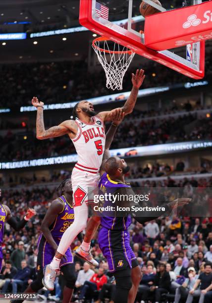 Chicago Bulls forward Derrick Jones Jr. And Los Angeles Lakers forward LeBron James go after a rebound during a NBA game between the Los Angeles...