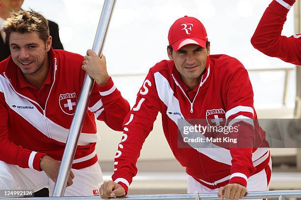 Stanislas Wawrinka and Roger Federer of Switzerland arrive by boat before the official draw for the Davis Cup World Group Playoff Tie between...