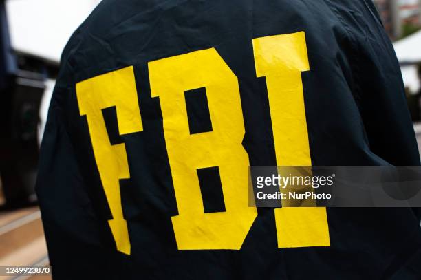 Member of the United States Federal Bureau of Investigation poses for an ilustrative photo during a press conference between the Colombian Judicial...
