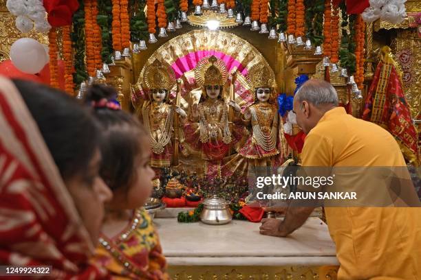 Devotees gather to offer prayers on the occasion of Rama Navami festival, marking the birth anniversary of Hindu god Rama at a temple in New Delhi on...