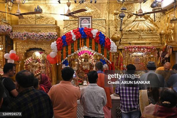 Devotees gather to offer prayers on the occasion of Rama Navami festival, marking the birth anniversary of Hindu god Rama at a temple in New Delhi on...