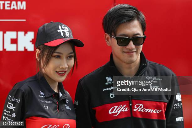 Zhou Guanyu of China and Alfa Romeo F1 Team Stake with a fan during previews ahead of the F1 Grand Prix of Australia at Melbourne Grand Prix Circuit...