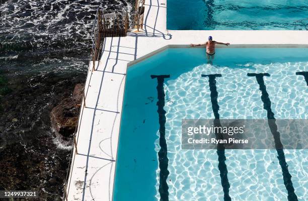 Swimmer stands in the pool at Bondi Icebergs on June 16, 2020 in Sydney, Australia. The Bondi Icebergs swimming pools reopened to public on 15th June...