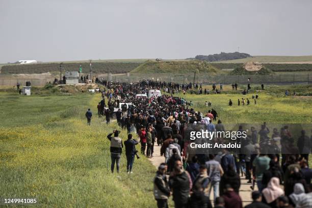 Palestinians holding banners and flags gather for an event held within the 47th anniversary of Land Day in Gaza City, Gaza on March 30, 2023....