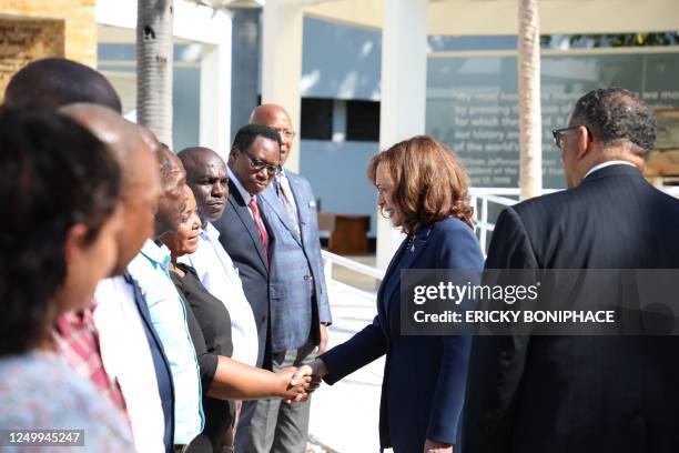 Vice President Kamala Harris greets survivors of the 1998 bombing of the American Embassy in Tanzania at National Museum and House of Culture in Dar...