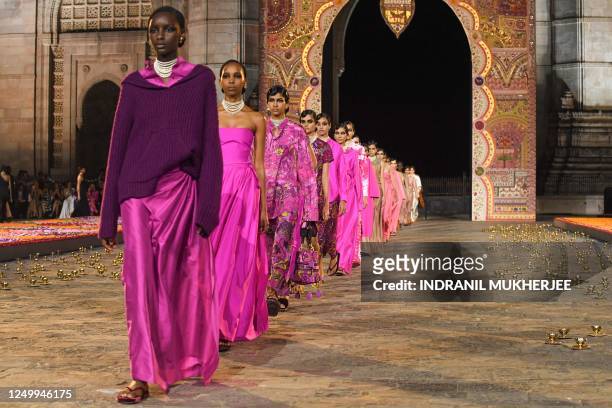 Models present creations from Christian Dior's Fall 2023 collection during a fashion show in Mumbai on March 30, 2023.