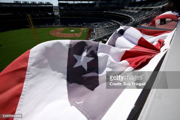 Bunting waves in the stands during batting practice prior to the game between the Atlanta Braves and the Washington Nationals at Nationals Park on...