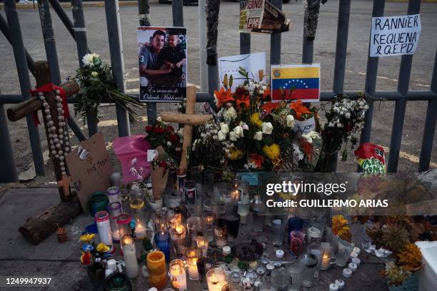 An altar is seen outside the immigration detention center where 39 migrants died during a fire in Ciudad Juarez, Chihuahua state, Mexico on March 30,...