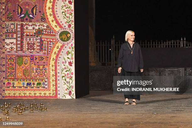 Creative Director Maria Grazia Chiuri greets the crowd after the Christian Dior's Fall 2023 collection fashion show in Mumbai on March 30, 2023.