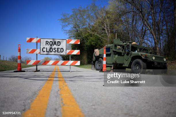 Humvee from the U.S. Army's 101st Airborne Division sits parked at a checkpoint near the site where two UH-60 Blackhawk helicopters crashed on March...