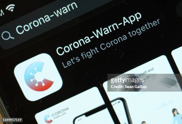 The newly-released "Corona-Warn-App" developed by the German government for tracing Covid-19 infections is seen for download on an Apple iPhone...