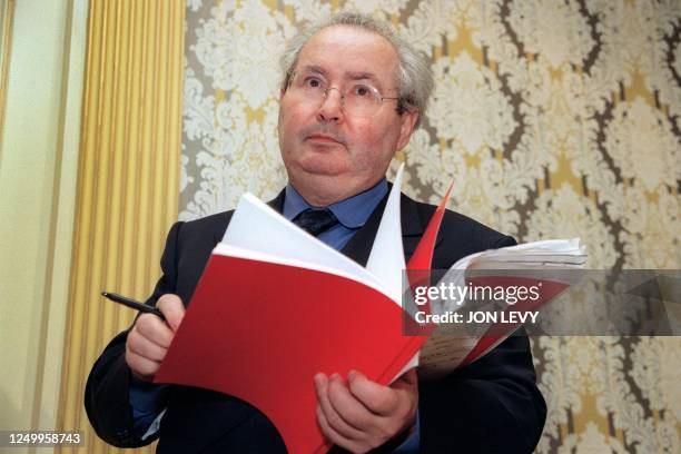 Serge Klarsfeld, world reknown Nazi hunter, checks his notes before holding a press conference in New York, 21 February naming Andre Bettencourt,...