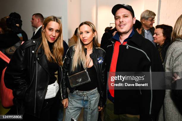 Guest, Angelica Mandy and guest attend a private view of "Times Are Hard For Dreamers" by Joe Sweeney hosted by Cob Gallery at Tuscany Wharf on March...