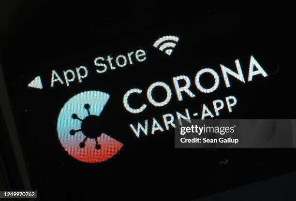 The newly-released "Corona-Warn-App" developed by the German government for tracing Covid-19 infections is seen on an Apple iPhone during the...