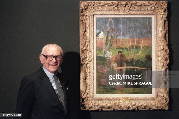 Dr. Armand Hammer stands 24 June 1988 with his painting "Bonjour M. Gauguin" which hi is loaning to the National Gallery of Art in Washington, D.C....