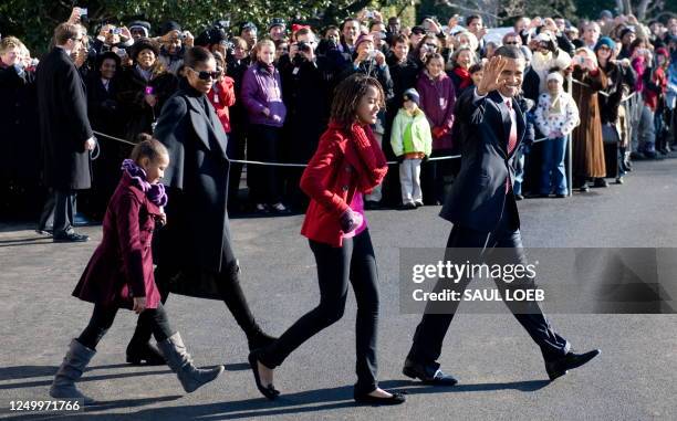 President Barack Obama walks with his daughters, Malia Obama and Sasha Obama and First Lady Michelle Obama to Marine One prior to departure from the...