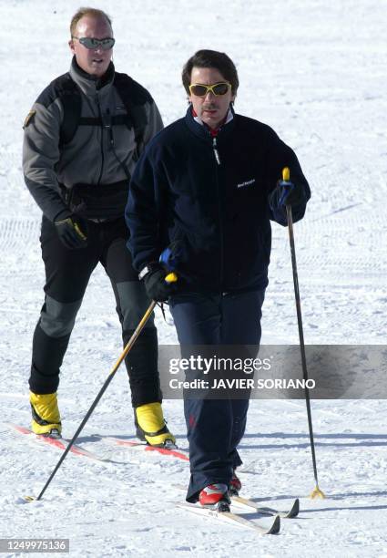 Spanish Prime Minister Jose Maria Aznar heads to the slopes for a bit of nordic skiing at the Baqueira Beret ski station, 27 December 2003, during...