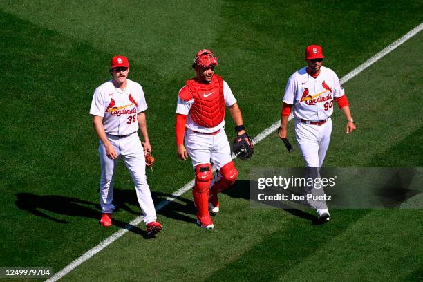 Miles Mikolas Willson Contreras and Pitching Coach Dusty Blake of the St. Louis Cardinals walk to the dug out prior to a game against the Toronto...