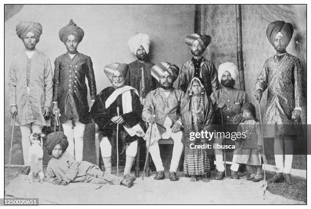 antique photograph of british navy and army: indian army family - headwear photos stock illustrations