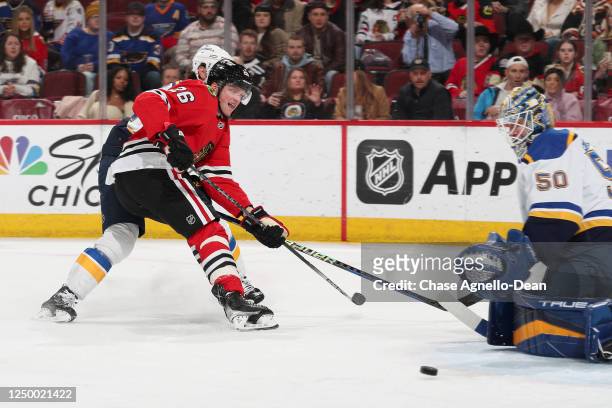 Austin Wagner of the Chicago Blackhawks attempts to get the puck past goalie Jordan Binnington of the St. Louis Blues in the first period at United...