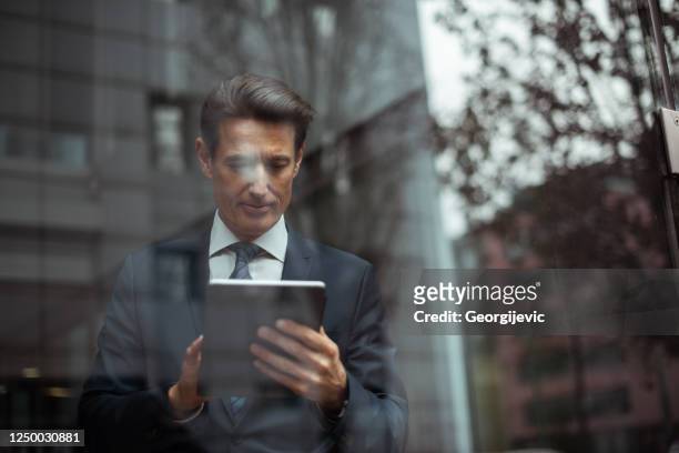 german businessman - infront the window - georgijevic frankfurt stock pictures, royalty-free photos & images
