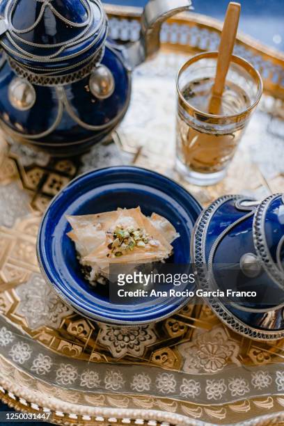 baklava on decorative tea set - turkish delight stock pictures, royalty-free photos & images