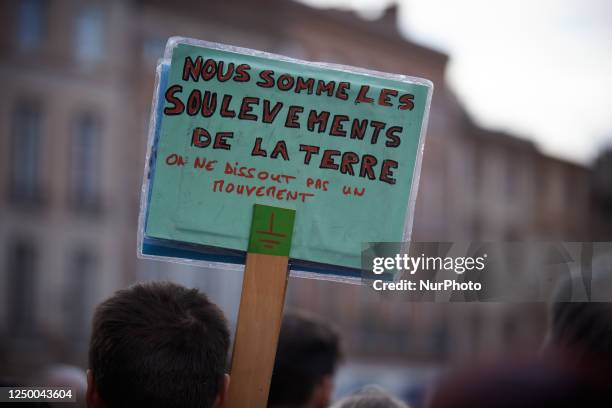 Protester is holding a placard reading ''We are Les Soulevements de la Terre, You can't ban a movement''. After the violence at Sainte-Soline on...