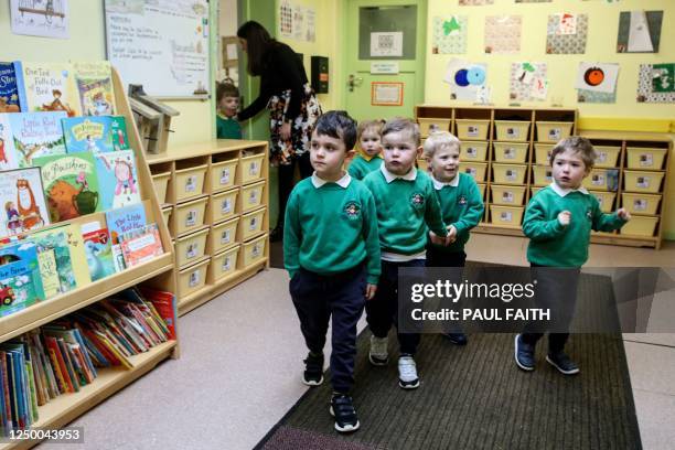 Pupils walk in the corridors on the first day of the newly opened Bangor Integrated Nursery school, one of the two outliers at kindergarten age, for...