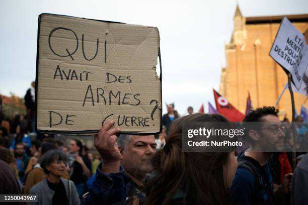 Man is holding a placard reading ''Who Got War Weapons?'' After the violence at Sainte-Soline on March 26th, the French Interior Minister Darmanin...