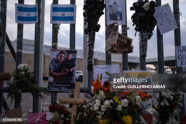 An altar is seen outside the immigration detention center where 39 migrants died in a fire in Ciudad Juarez, Chihuahua state, Mexico, on March 30,...