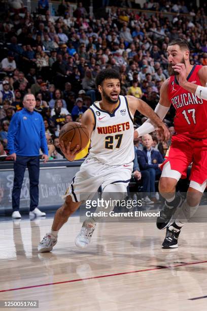 Jamal Murray of the Denver Nuggets dribbles the ball during the game against the New Orleans Pelicans on March 31, 2023 at the Ball Arena in Denver,...