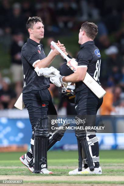 New Zealand's Will Young and Henry Nicholls celebrate their team's victory in the third one-day international cricket match between New Zealand and...
