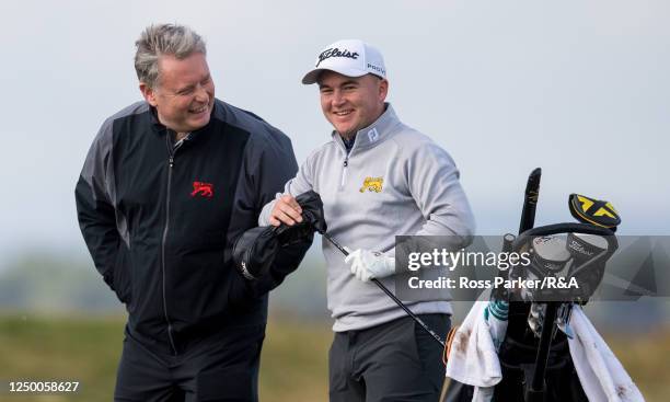 Great Britain and Ireland captain Stuart Wilson shares a joke with John Gough during a Walker Cup Squad Practice Session at St Andrews Old Course on...