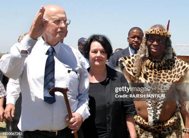 Former South African President during the apartheid regime PW Botha waves next to wife Barbara and Prince Gideon Zulu at thousands of people...