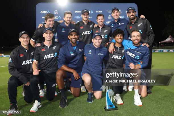 New Zealand players pose as they celebrate winning the series 2-0 following their team's victory in the third one-day international cricket match...