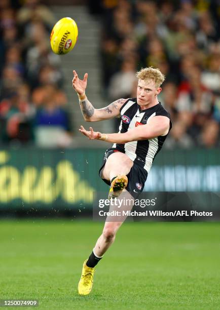 John Noble of the Magpies kicks the ball during the 2023 AFL Round 03 match between the Collingwood Magpies and the Richmond Tigers at the Melbourne...