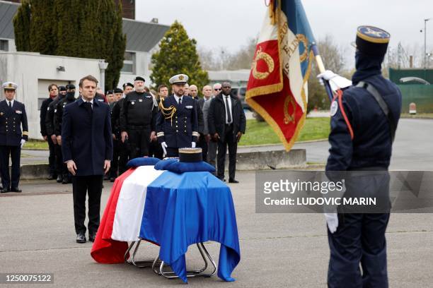 French President Emmanuel Macron stands beside the coffin during a ceremony in tribute to French GIGN gendarme Marechal des Logis-Chef Arnaud Blanc,...