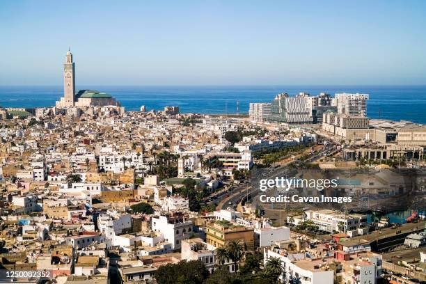 elevated view of casablanca city with grand mosque and the atlantic - モロッコ カサブランカ ストックフォトと画像