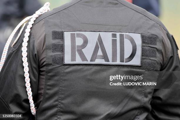 Photo shows a badge on a uniform of French police RAID elite unit during ceremony in tribute to French GIGN gendarme Marechal des Logis-Chef Arnaud...