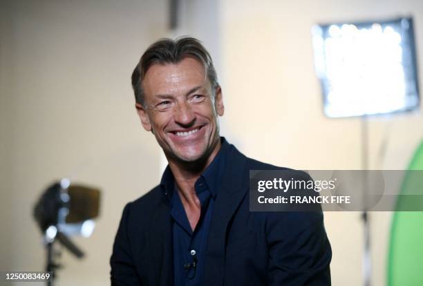 France's women's team newly appointed head coach Herve Renard reacts during a TV interview after addressing media at the French Football Federation...