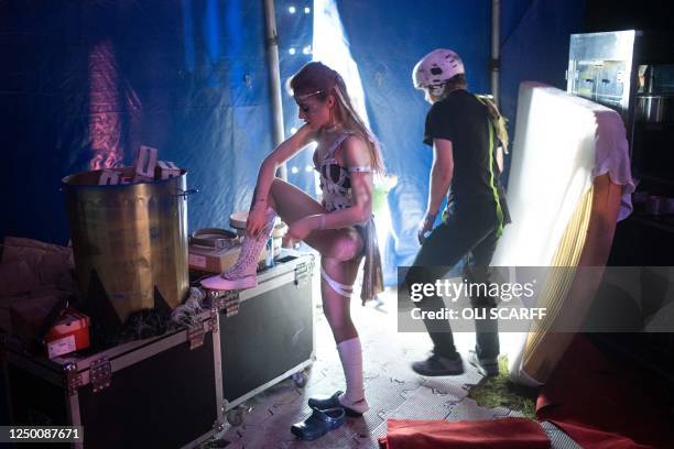 Ksenia Archer , a Wire Walker with Circus Cortex, removes her boots backstage after taking part in a dress rehearsal of their show 'Warriors' in...
