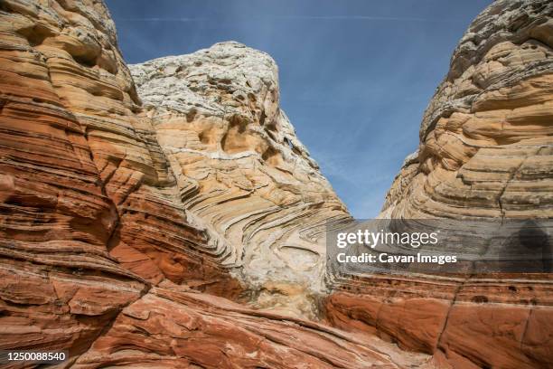 a wave-like sandstone formation in white pocket, vermilion cliffs - the wave utah stock pictures, royalty-free photos & images