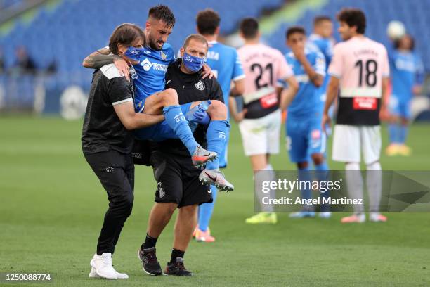 Erick Cabaco of Getafe is carried off injured by medical staff during the Liga match between Getafe CF and RCD Espanyol at Coliseum Alfonso Perez on...