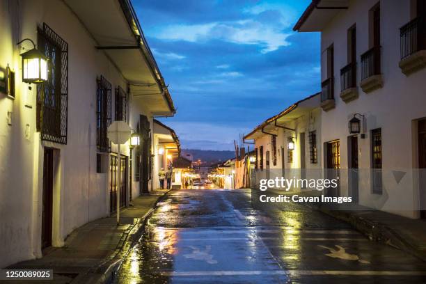 wet and empty street in popayan, colombia - colombia street stock pictures, royalty-free photos & images